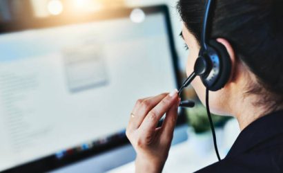 Rearview shot of a young woman working in a call centre